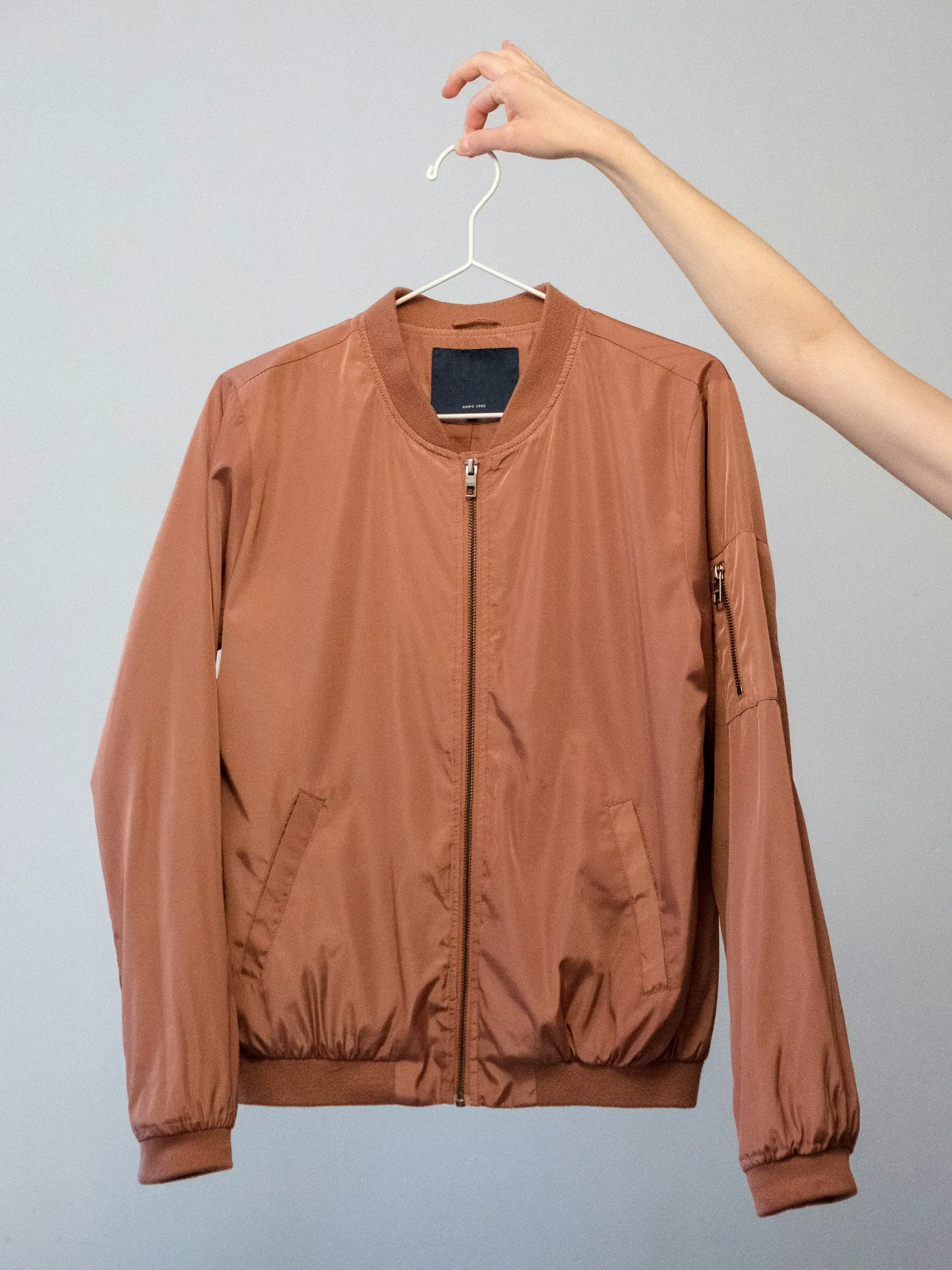 Tan bomber jacket on a hanger — stock illustration for jackets