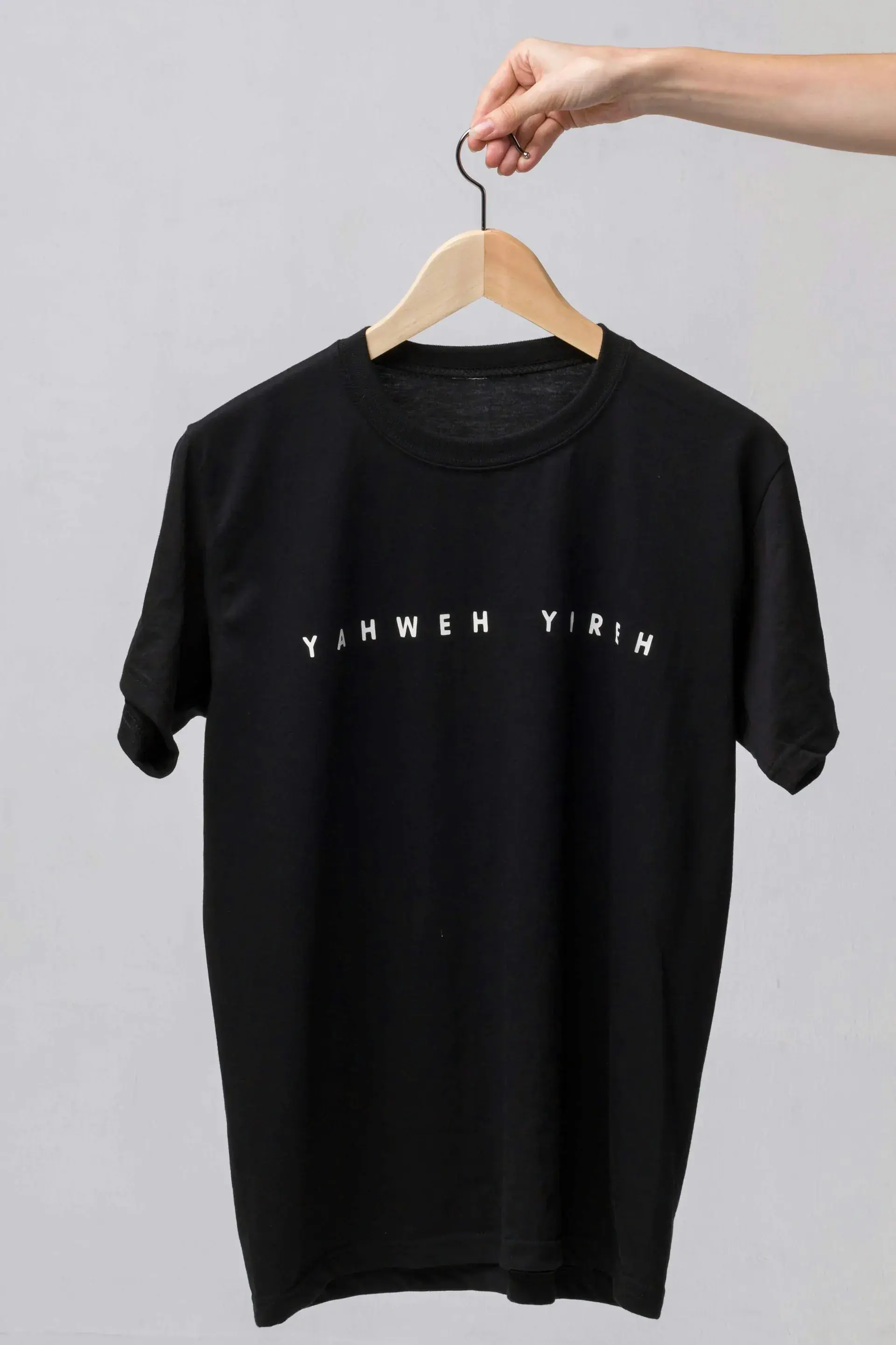 Plain black t-shirt on a hanger — stock illustration for t-shirts